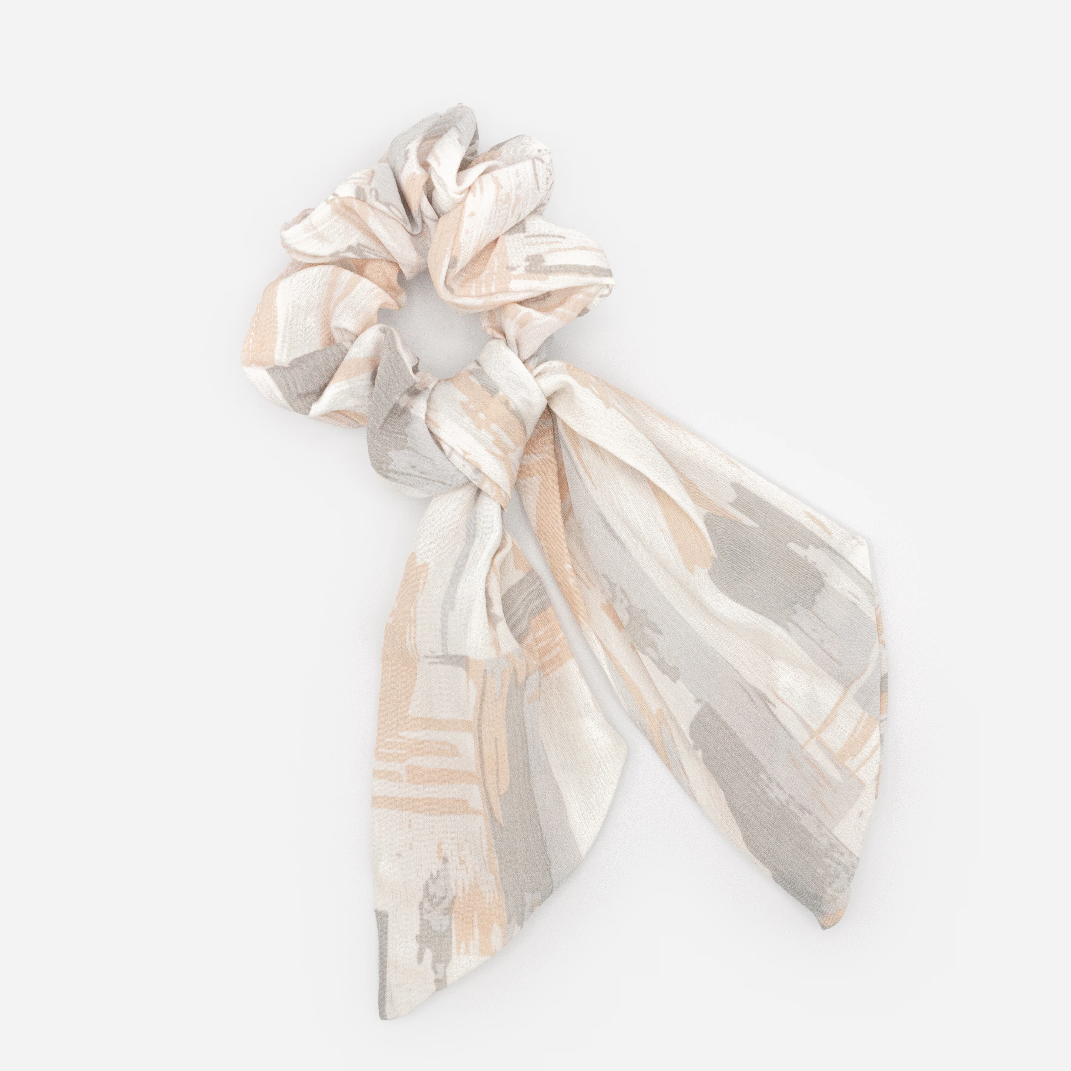 Chouchou blanc à boucle avec taches grises et pêche