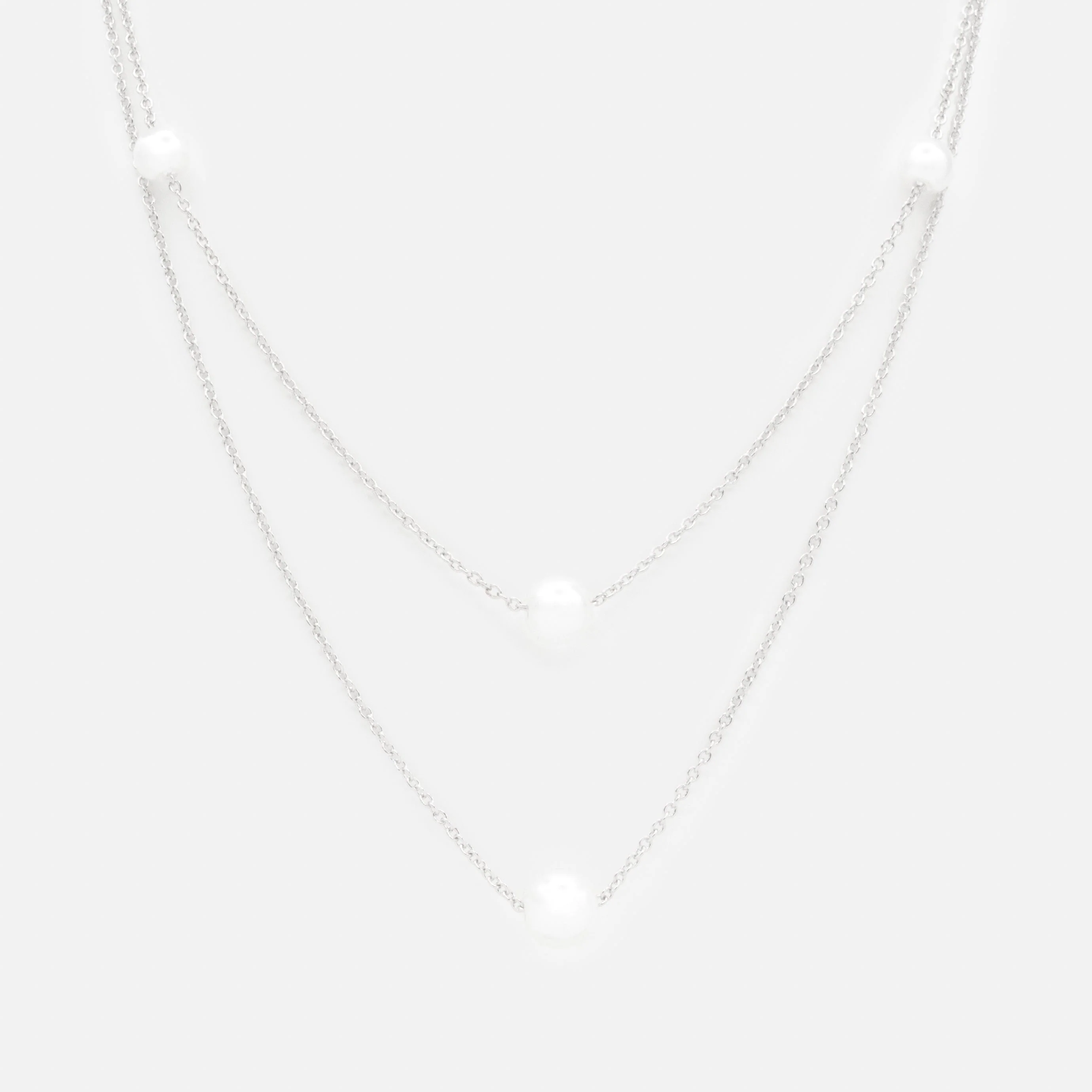 Collier argenté double chaîne avec perles rondes
