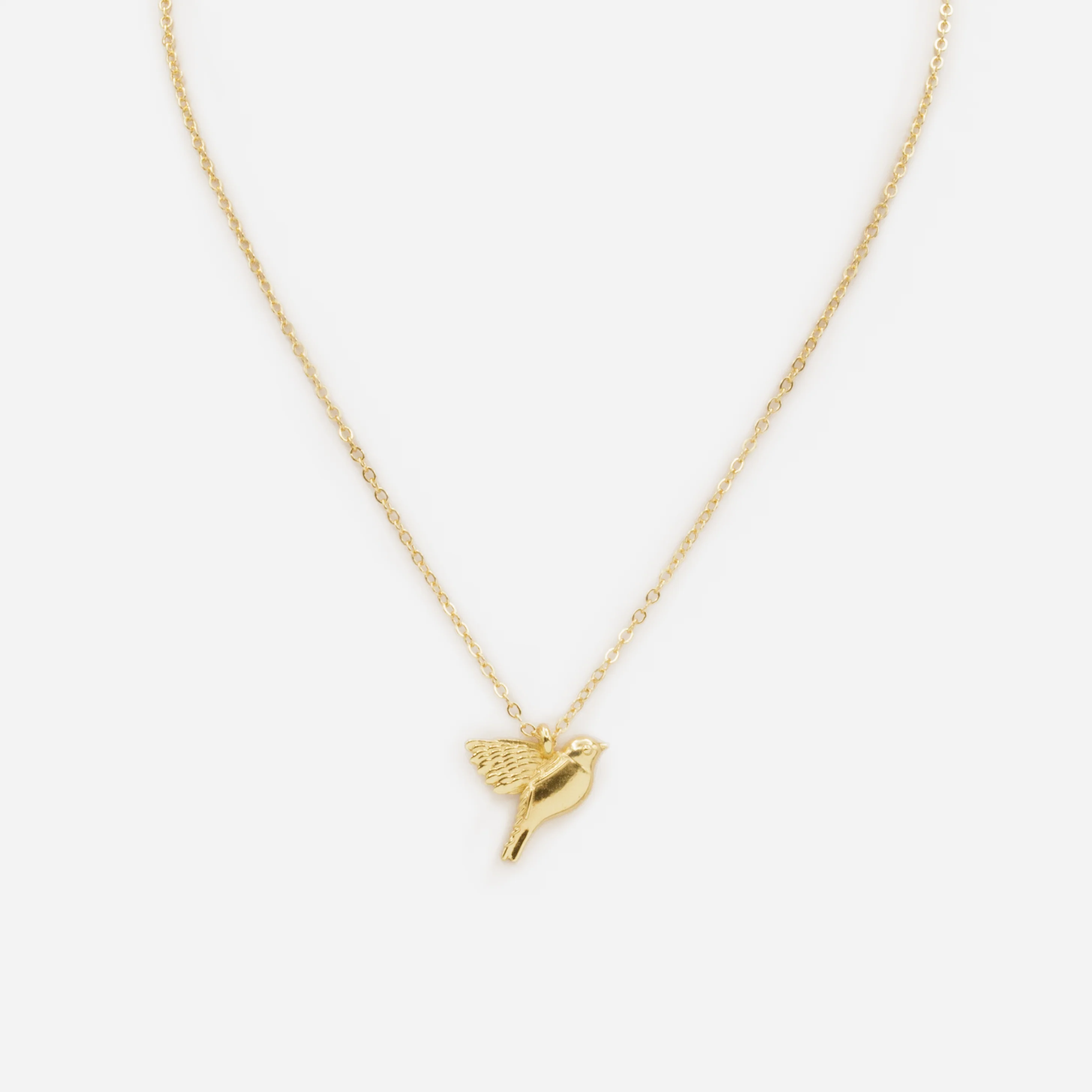 Collier doré avec breloque oiseau