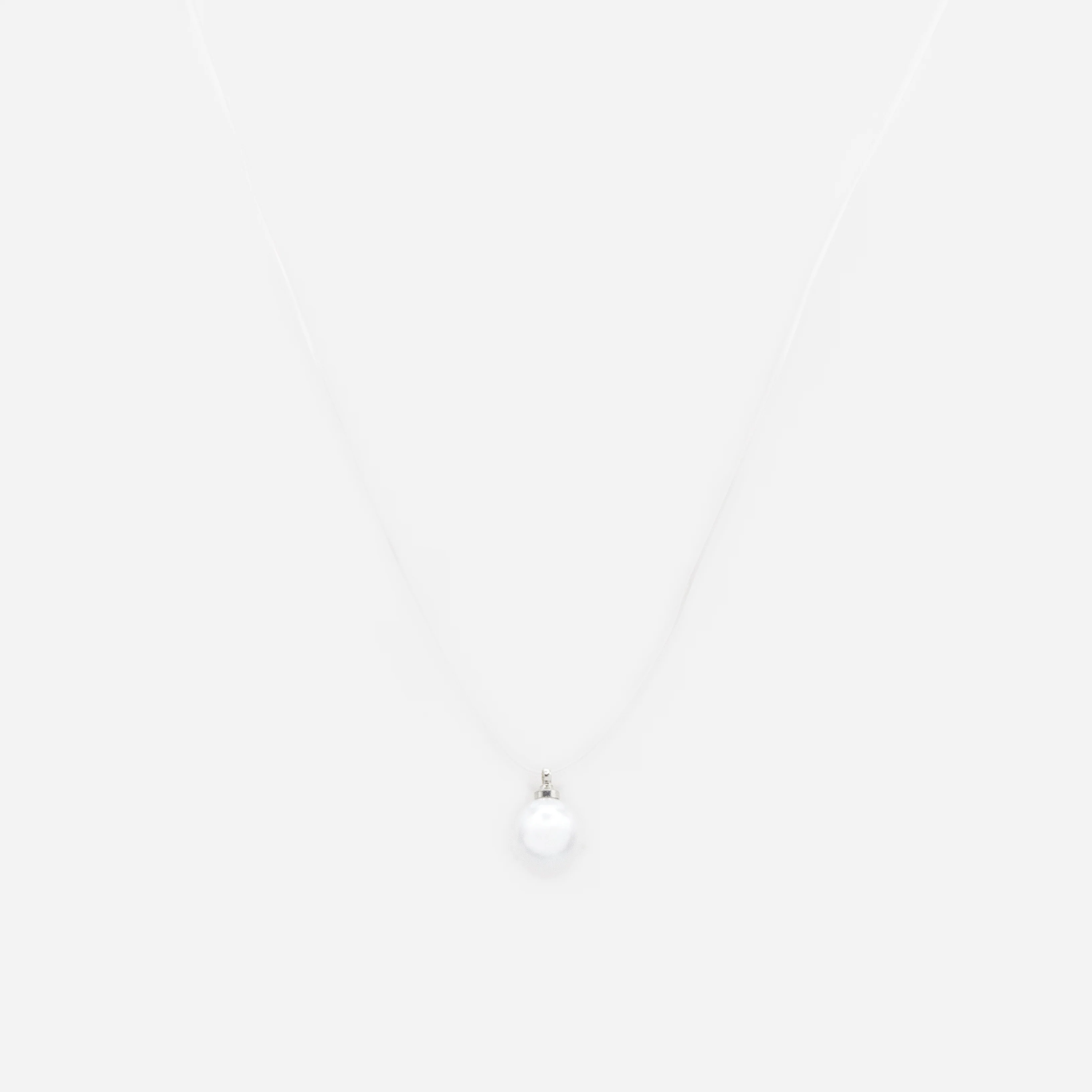 Collier transparent avec perle solitaire