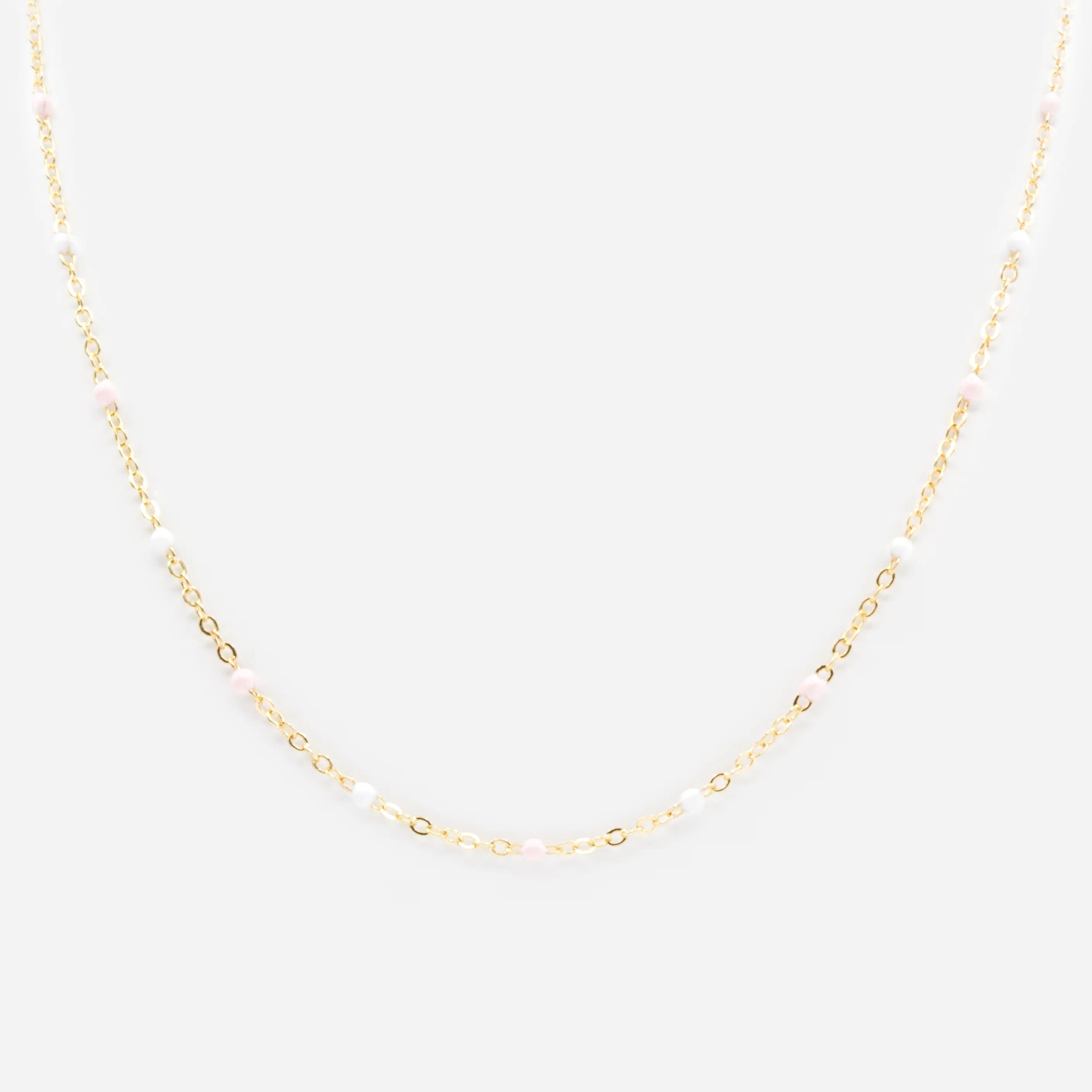 Collier doré avec billes roses et blanches