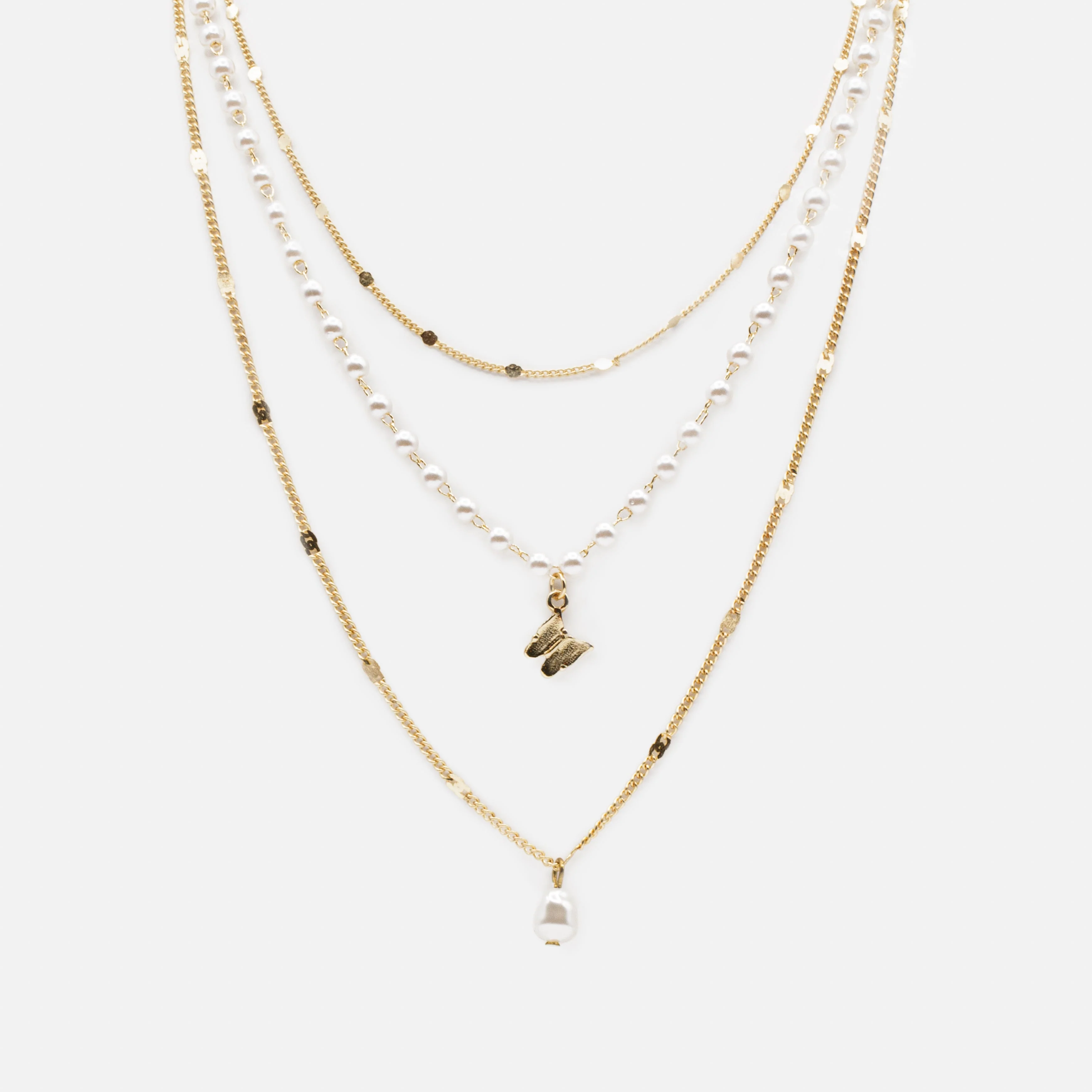 Collier doré triple chaîne breloques perle synthétique et papillon