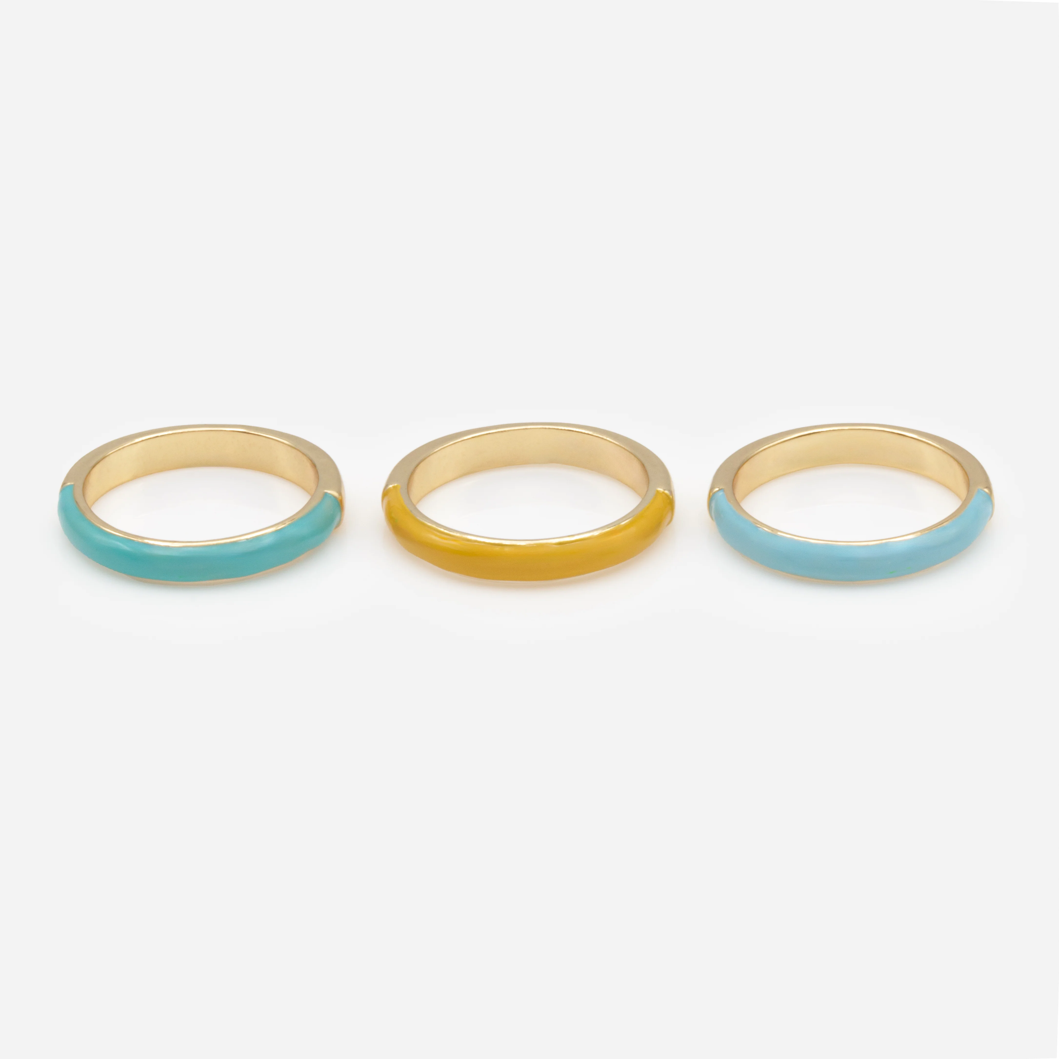 Trio de bagues dorées avec bande colorée