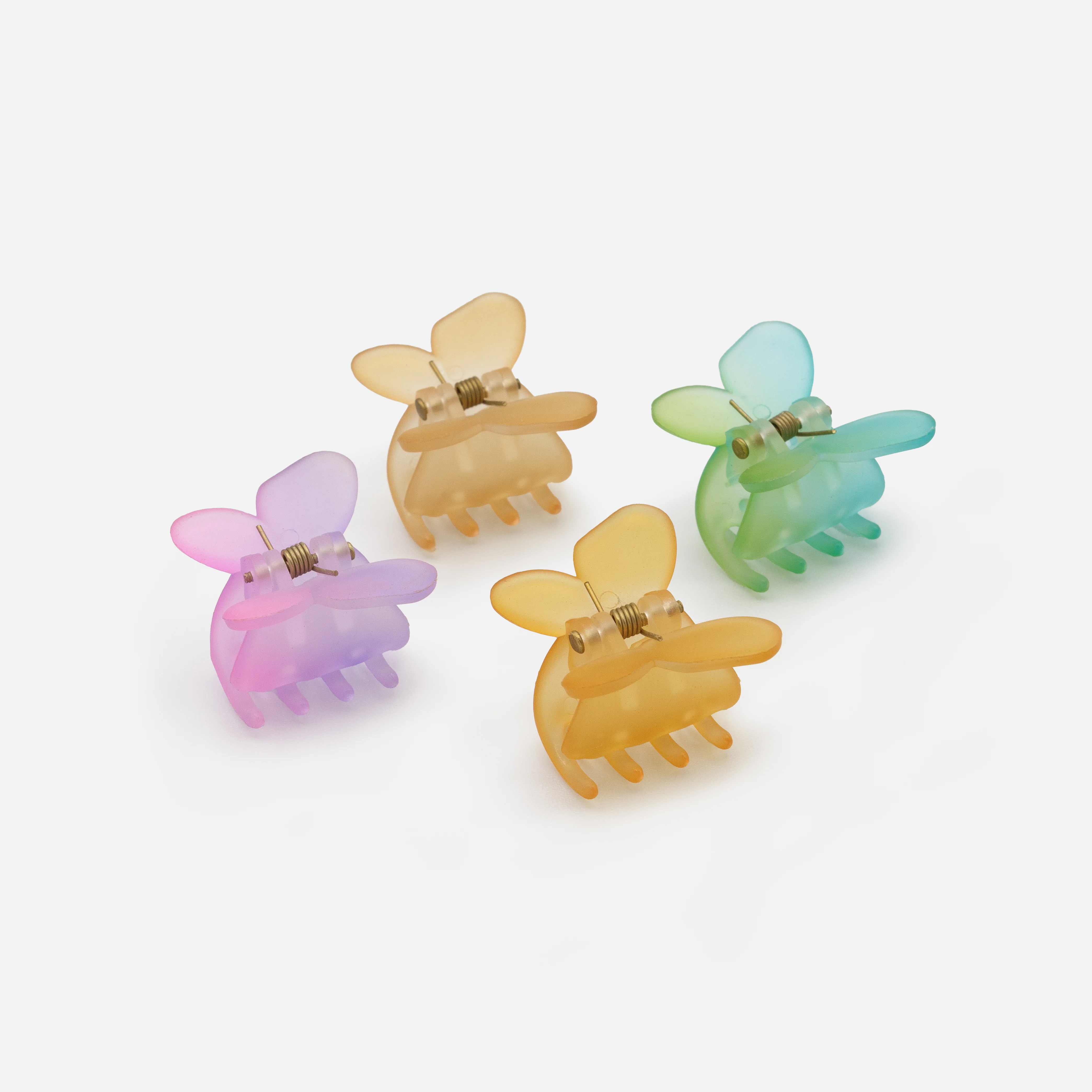 Ensemble de quatre petites pinces papillons multicolores