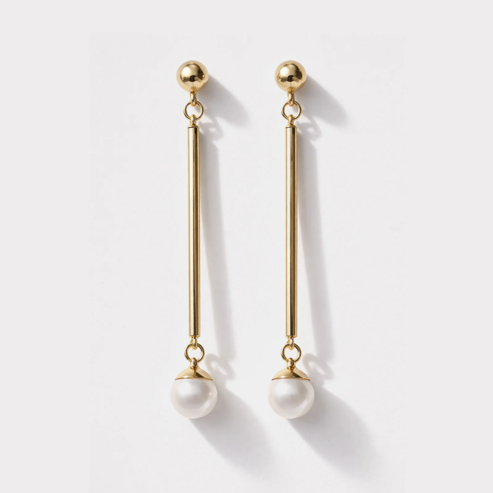 Longues boucles d'oreilles dorées en acier inoxydable avec perle